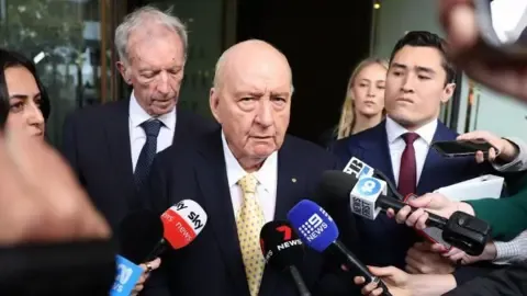 Indecent Assault Charges Against Top Australian Media Personality Downgraded